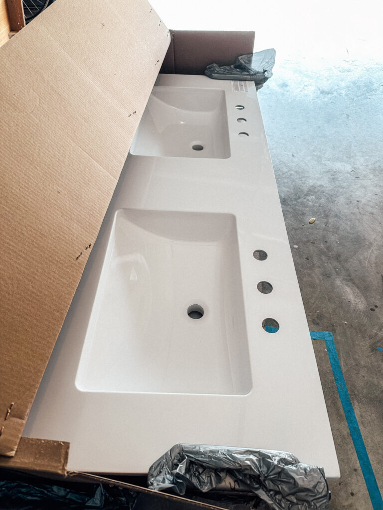 cultured marble double vanity top in an opened box