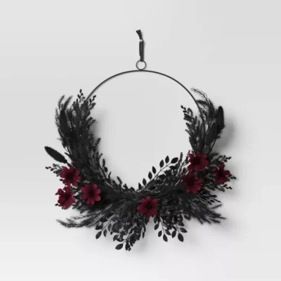 black wreath with red flowers