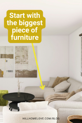 Neutral living room with a large sectional sofa. The text highlights the importance of starting with the biggest piece of furniture when designing a space.