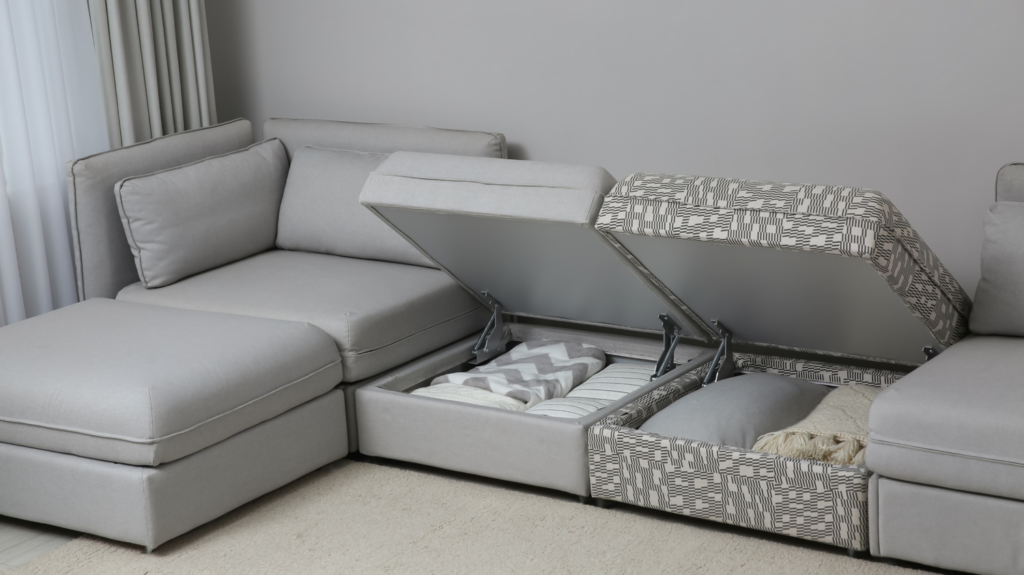 a gray couch with hidden storage under the cushion